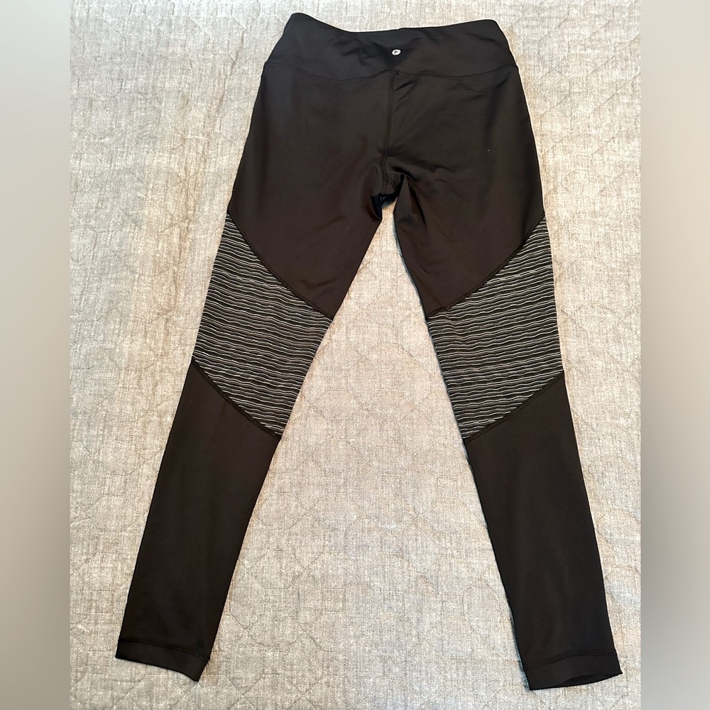 Full length black leggings with black-and-white detail